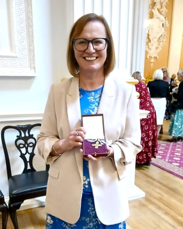 Anne receiving her Order of Mercy Medal